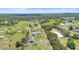 Aerial view of property showing a large home, equestrian area, surrounded by serene landscape at 700 Old Geneva Rd, Geneva, FL 32732