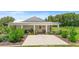 Outdoor patio area with seating for entertaining and beautifully landscaped planters at 700 Old Geneva Rd, Geneva, FL 32732