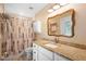 Bathroom featuring a granite vanity and shower with decorative curtain at 700 Old Geneva Rd, Geneva, FL 32732
