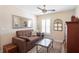 Bedroom featuring a sofa, mirror, window with plantation shutters, and rug at 700 Old Geneva Rd, Geneva, FL 32732