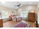 Bright bedroom with vaulted ceiling, wood floors, and coordinated bedding at 700 Old Geneva Rd, Geneva, FL 32732