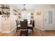 Charming dining area with rattan chairs, decor, and a light fixture creating a cozy space for meals at 700 Old Geneva Rd, Geneva, FL 32732