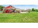This single-Gathering home has decorative flower beds surrounding the property at 700 Old Geneva Rd, Geneva, FL 32732