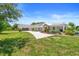 Charming single story home with a well-manicured lawn, beautiful landscaping, and a large driveway at 700 Old Geneva Rd, Geneva, FL 32732