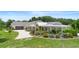 Charming single story home with a well-manicured lawn and beautiful landscaping at 700 Old Geneva Rd, Geneva, FL 32732