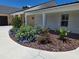 Well-maintained home featuring beautiful landscaping with colorful flowers and a circular walkway at 700 Old Geneva Rd, Geneva, FL 32732
