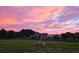 Scenic view of the home at sunset, with livestock in the yard at 700 Old Geneva Rd, Geneva, FL 32732