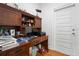 Home office with built-in desk, storage, and natural light at 700 Old Geneva Rd, Geneva, FL 32732