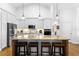 Spacious kitchen featuring a large island with bar seating and stainless steel appliances at 700 Old Geneva Rd, Geneva, FL 32732