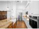 Open-concept kitchen with stainless steel appliances and a large center island at 700 Old Geneva Rd, Geneva, FL 32732