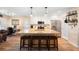 Stylish kitchen island with bar seating, stainless appliances and open layout to the living area at 700 Old Geneva Rd, Geneva, FL 32732