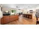Open-concept living space with kitchen island and ample natural light from sliding glass doors at 700 Old Geneva Rd, Geneva, FL 32732