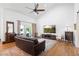 Cozy living room showcasing hardwood floors, a ceiling fan, and a sliding glass door at 700 Old Geneva Rd, Geneva, FL 32732