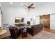 Inviting living room with hardwood floors, cozy leather seating, and an entertainment center at 700 Old Geneva Rd, Geneva, FL 32732