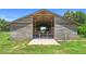 Exterior view of a large outbuilding with an open floor plan and overhead truss system at 700 Old Geneva Rd, Geneva, FL 32732
