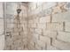 Close up of shower featuring stylish stone-look tile work and decorative inlays at 700 Old Geneva Rd, Geneva, FL 32732
