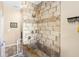 Walk-in shower featuring stylish stone-look tiles with inlays and a built-in bench at 700 Old Geneva Rd, Geneva, FL 32732