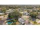 Lovely aerial view of homes in a quiet, well-maintained neighborhood with mature trees and manicured lawns at 7331 Blue Jacket W Pl, Winter Park, FL 32792
