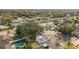 Lovely aerial view of homes in a quiet, well-maintained neighborhood with mature trees and manicured lawns at 7331 Blue Jacket W Pl, Winter Park, FL 32792