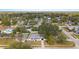 Charming single-story home with a well-kept lawn, surrounded by mature trees in a peaceful residential area at 7331 Blue Jacket W Pl, Winter Park, FL 32792