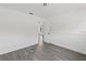Open doorway to bright bedroom with modern gray flooring and clean white walls at 7331 Blue Jacket W Pl, Winter Park, FL 32792