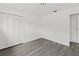 A clean bedroom features sleek gray floors and a closet for ample storage space at 7331 Blue Jacket W Pl, Winter Park, FL 32792