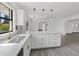 Modern kitchen with granite countertops, stainless steel sink, and a view into the adjacent living spaces at 7331 Blue Jacket W Pl, Winter Park, FL 32792
