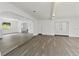 Bright and spacious living room boasts neutral paint, modern floors, and ample natural light at 7331 Blue Jacket W Pl, Winter Park, FL 32792