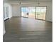 Spacious living room with large sliding doors leading to an outdoor patio at 7331 Blue Jacket W Pl, Winter Park, FL 32792
