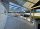 Enclosed patio area with a transparent roof and concrete flooring, offering outdoor relaxation space at 7331 Blue Jacket W Pl, Winter Park, FL 32792