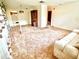 Spacious living room with plush carpeting and open floorplan at 8547 Cedar Cove Dr, Orlando, FL 32819