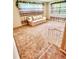 Spacious living room with plush carpeting, staircase, and natural light from large windows at 8547 Cedar Cove Dr, Orlando, FL 32819