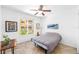 Bedroom with neutral color palette, natural light, wooden desk and tiled floor at 860 N Orange Ave # 210, Orlando, FL 32801