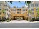 Beautiful multi-story building with a grand entryway and lush landscaping at 860 N Orange Ave # 210, Orlando, FL 32801