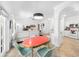 Open concept layout with dining area and an adjacent kitchen and living room at 860 N Orange Ave # 210, Orlando, FL 32801