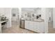Modern kitchen featuring stainless steel appliances and sleek white cabinets at 860 N Orange Ave # 210, Orlando, FL 32801