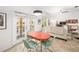 Cozy living room with unique retro dining set, French doors, and contemporary decor at 860 N Orange Ave # 210, Orlando, FL 32801