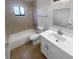 Updated bathroom featuring tile backsplash, and a modern vanity at 9744 Tattersall Ave, Orlando, FL 32817