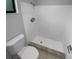 Bathroom with a white toilet and a fully tiled walk-in shower at 9744 Tattersall Ave, Orlando, FL 32817
