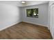 Bedroom showcasing a window and neutral paint with bright white baseboards at 9744 Tattersall Ave, Orlando, FL 32817