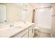 Bathroom with dual sinks, a large mirror, and a shower-tub combo for a complete bathing experience at 1023 Sugarwood St, Davenport, FL 33837