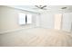 Spacious, carpeted bedroom with ample natural light, perfect for creating a comfortable retreat at 1023 Sugarwood St, Davenport, FL 33837