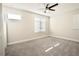 Bedroom with three windows that brings ample natural light throughout the room at 1023 Sugarwood St, Davenport, FL 33837