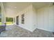 Inviting front porch with stone columns and tiled floor at 10750 Sw 110Th St, Dunnellon, FL 34432