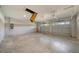 Spacious two-car garage with two garage door openers and an unfinished ceiling with pull-down stairs at 10750 Sw 110Th St, Dunnellon, FL 34432