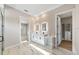 Contemporary main bathroom featuring illuminated mirrors, double vanity, and tile floors at 10750 Sw 110Th St, Dunnellon, FL 34432