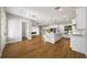 Bright, open floorplan with wood floors connecting the kitchen, living, and dining areas at 10750 Sw 110Th St, Dunnellon, FL 34432