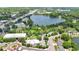 Stunning aerial view showcasing a lake, surrounding buildings, and vibrant green landscape at 110 Todd Dr, Casselberry, FL 32707
