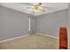 Bedroom featuring neutral carpet and a ceiling fan, offering a cozy and comfortable space at 110 Todd Dr, Casselberry, FL 32707