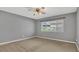Comfortable bedroom with neutral walls, a ceiling fan, and a window providing natural light at 110 Todd Dr, Casselberry, FL 32707